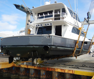 A boat is docked on the dock and ready to be loaded.