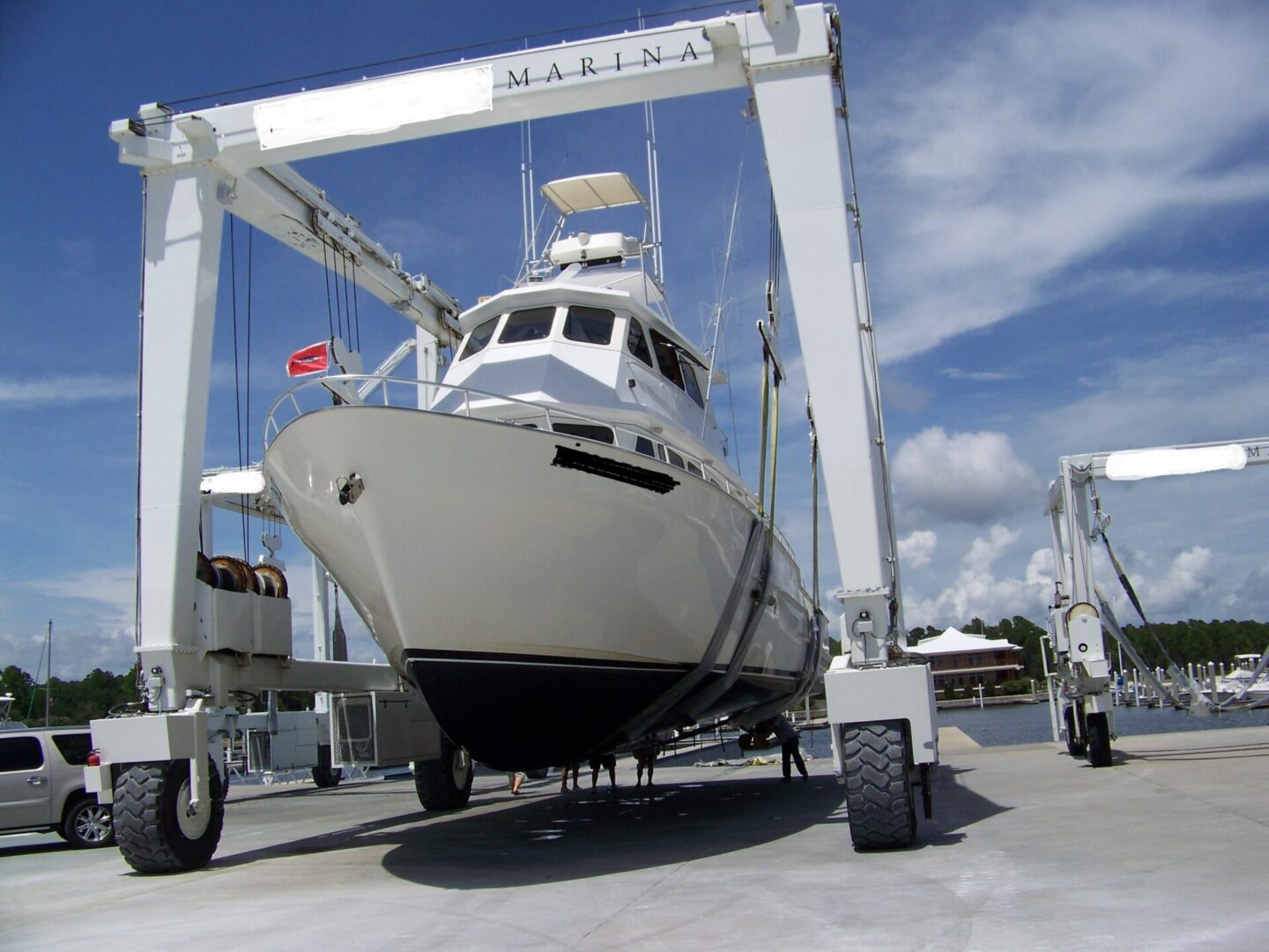 A boat is being lifted by a crane.