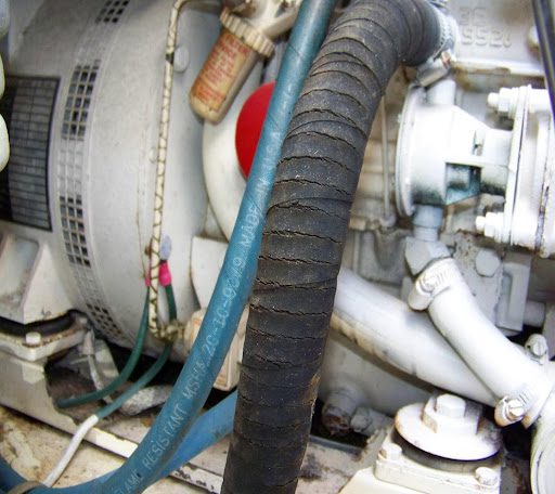 A close up of the hose on an engine