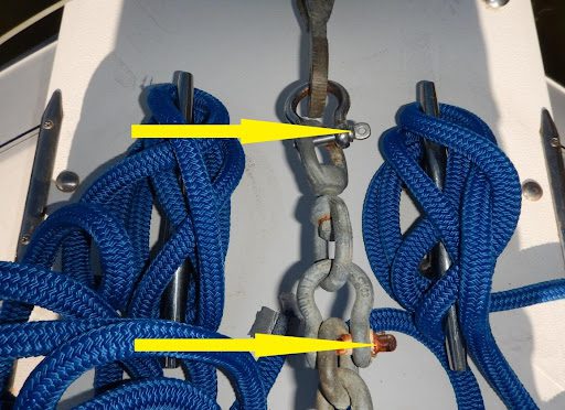 A bunch of ropes are tied to the side of a boat.